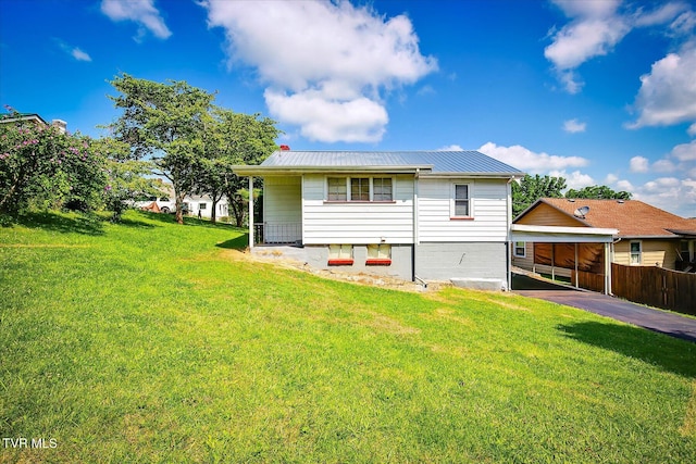 227 Jonesboro Dr, Bluff City, TN 37618 - back of house featuring a metal roof and a carport