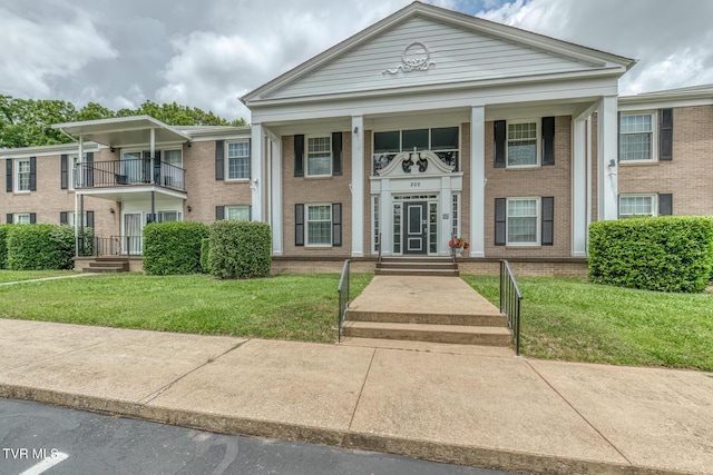 202 University Pkwy Unit 4E, Johnson City, TN 37604 - greek revival inspired property featuring brick siding and a front yard