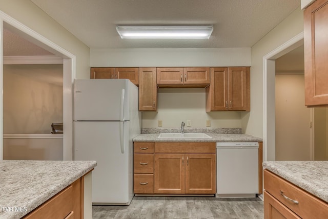 202 University Pkwy Unit 4E, Johnson City, TN 37604 - kitchen featuring white appliances, light wood-type flooring, light countertops, and brown cabinetry