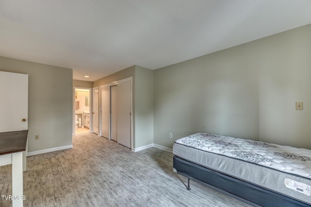 202 University Pkwy Unit 4E, Johnson City, TN 37604 - bedroom featuring wood finished floors, a closet, and recessed lighting