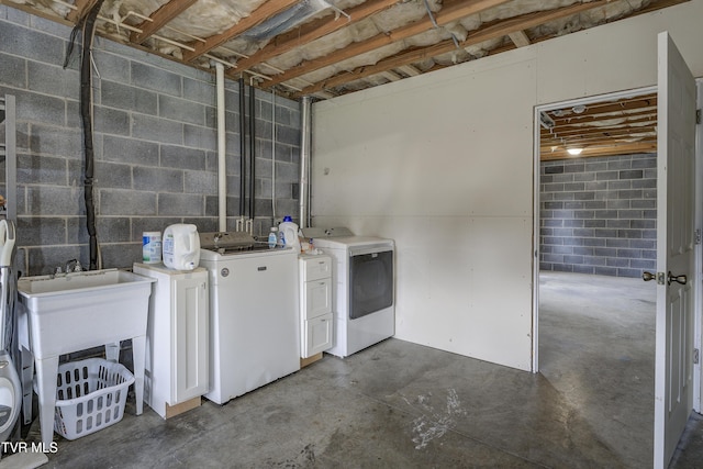 33 Mockingbird Ct, Jonesborough, TN 37659 - laundry room with washing machine and clothes dryer, concrete block wall, and cabinet space