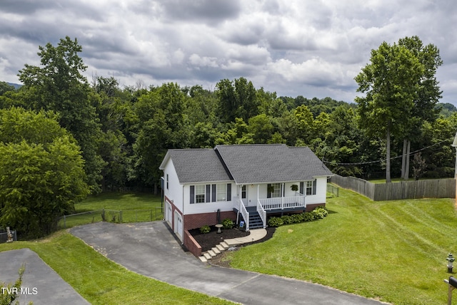 33 Mockingbird Ct, Jonesborough, TN 37659 - view of front of property featuring a porch, driveway, a garage, a view of trees, and roof with shingles