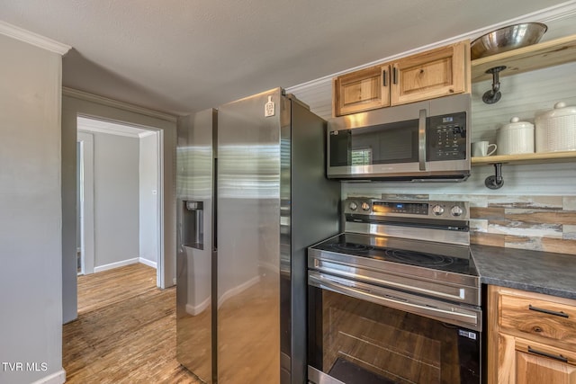 406 Mclaney Rd, Watauga, TN 37694 - kitchen with appliances with stainless steel finishes, dark countertops, wood finished floors, and ornamental molding