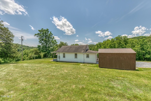 406 Mclaney Rd, Watauga, TN 37694 - rear view of property featuring a yard and a storage unit