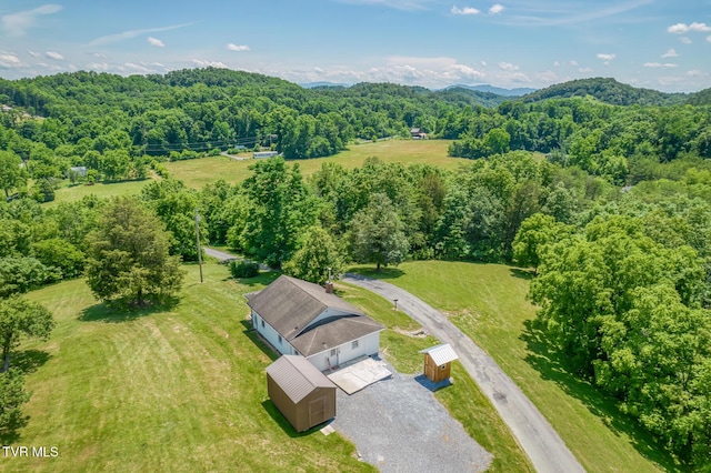 406 Mclaney Rd, Watauga, TN 37694 - aerial view of property and surrounding area featuring a heavily wooded area and a mountain backdrop