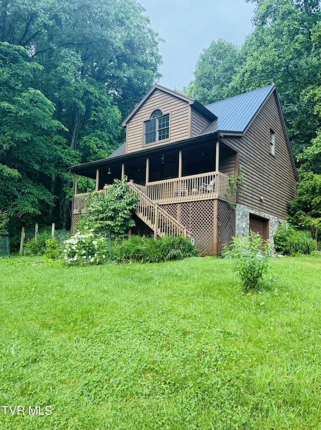 103 Meadow Springs Ct, Flag Pond, TN 37657 - view of front of home with an attached garage, a front lawn, a metal roof, stairway, and stone siding