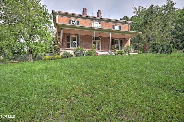 2061 King College Rd, Bristol, TN 37620 - view of front facade with brick siding, a chimney, and a porch