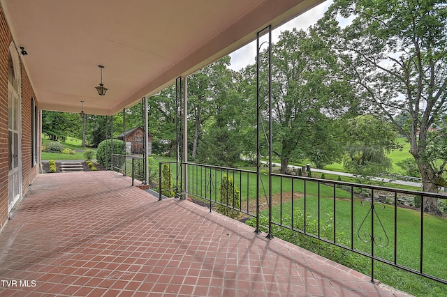 2061 King College Rd, Bristol, TN 37620 - covered porch with a lawn and view of wooded area