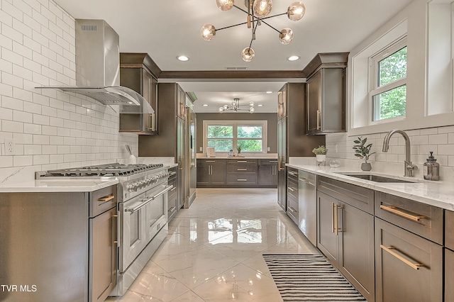 2061 King College Rd, Bristol, TN 37620 - kitchen featuring a chandelier, appliances with stainless steel finishes, light marble finish flooring, wall chimney range hood, and recessed lighting