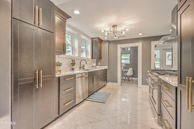 2061 King College Rd, Bristol, TN 37620 - kitchen with wall chimney range hood, recessed lighting, a chandelier, stainless steel appliances, and light countertops