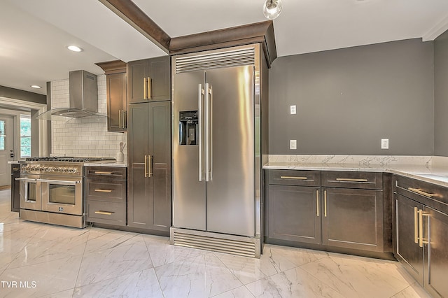 2061 King College Rd, Bristol, TN 37620 - kitchen with premium appliances, wall chimney exhaust hood, light marble finish floors, recessed lighting, and backsplash