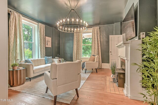 2061 King College Rd, Bristol, TN 37620 - living room featuring light wood finished floors and a chandelier