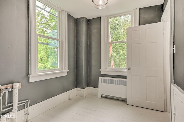 2061 King College Rd, Bristol, TN 37620 - unfurnished room featuring radiator heating unit and tile patterned floors