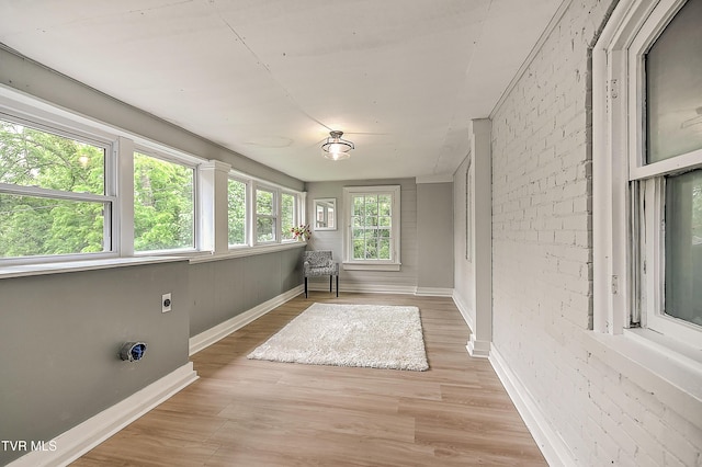 2061 King College Rd, Bristol, TN 37620 - unfurnished sunroom featuring baseboards and wood finished floors