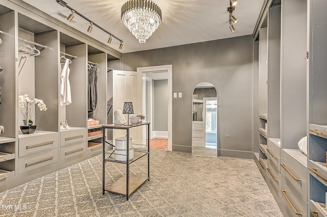 2061 King College Rd, Bristol, TN 37620 - walk in closet featuring arched walkways and a chandelier