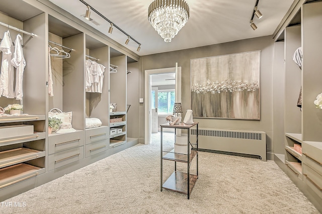 2061 King College Rd, Bristol, TN 37620 - walk in closet with radiator, carpet flooring, and a chandelier