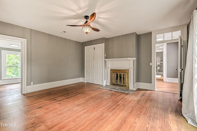 2061 King College Rd, Bristol, TN 37620 - unfurnished living room with ceiling fan, wood-type flooring, and a fireplace with flush hearth