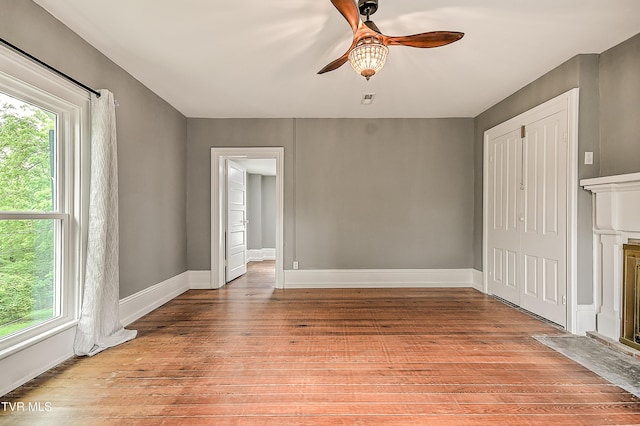 2061 King College Rd, Bristol, TN 37620 - unfurnished living room with a ceiling fan, light wood-style flooring, and a fireplace