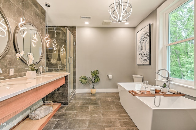 2061 King College Rd, Bristol, TN 37620 - bathroom featuring a freestanding bath, a shower stall, double vanity, healthy amount of natural light, and recessed lighting