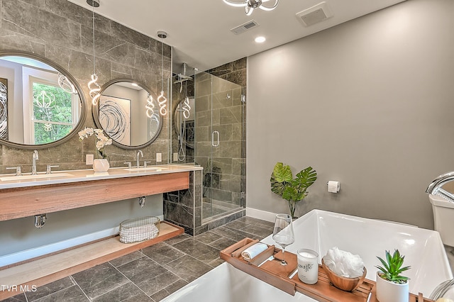 2061 King College Rd, Bristol, TN 37620 - full bathroom featuring a freestanding tub, a shower stall, and double vanity