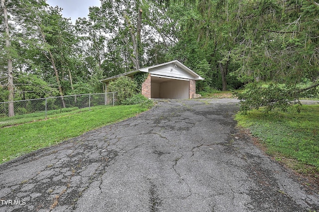 2061 King College Rd, Bristol, TN 37620 - garage featuring driveway and a wooded view