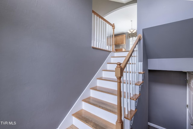 5 Pinehurst Ct, Limestone, TN 37681 - staircase featuring a chandelier and arched walkways