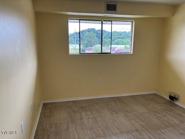 1085 Carriage Cir Unit 301, Bristol, VA 24201 - unfurnished room featuring baseboards