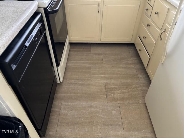 1085 Carriage Cir Unit 301, Bristol, VA 24201 - laundry view of dishwasher and wood tiled floors