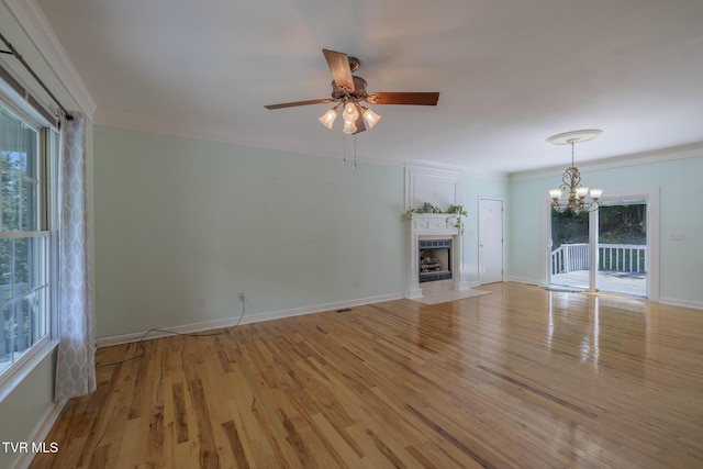 566 Beechwood Rd, Kingsport, TN 37663 - unfurnished living room with light wood-style flooring, a chandelier, a ceiling fan, a fireplace with flush hearth, and ornamental molding