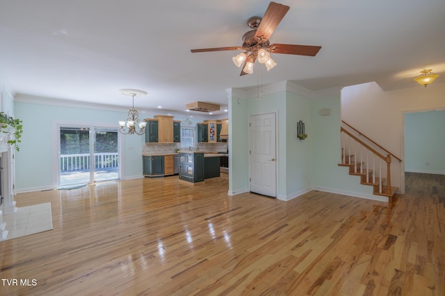 566 Beechwood Rd, Kingsport, TN 37663 - unfurnished living room with stairs, a ceiling fan, a chandelier, light wood finished floors, and ornamental molding