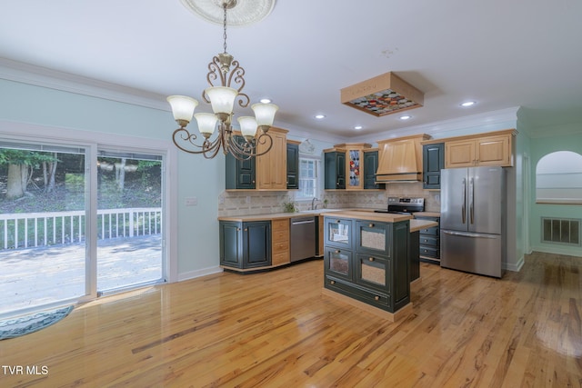 566 Beechwood Rd, Kingsport, TN 37663 - kitchen with appliances with stainless steel finishes, light countertops, ornamental molding, a chandelier, and backsplash