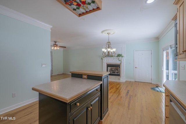 566 Beechwood Rd, Kingsport, TN 37663 - kitchen with a fireplace with flush hearth, a center island, stainless steel dishwasher, crown molding, and light wood-style floors