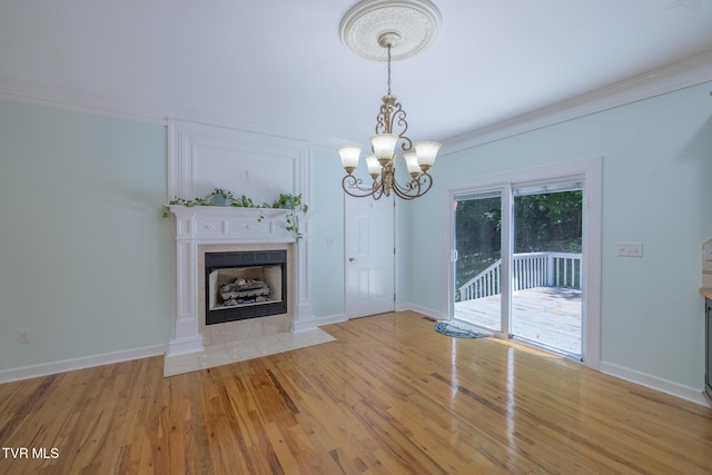 566 Beechwood Rd, Kingsport, TN 37663 - unfurnished living room with a chandelier, a fireplace, light wood-type flooring, and crown molding