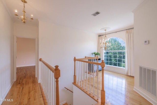 566 Beechwood Rd, Kingsport, TN 37663 - corridor featuring an upstairs landing, a chandelier, light wood finished floors, and ornamental molding