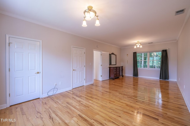 566 Beechwood Rd, Kingsport, TN 37663 - unfurnished living room featuring a chandelier, light wood-style flooring, and crown molding