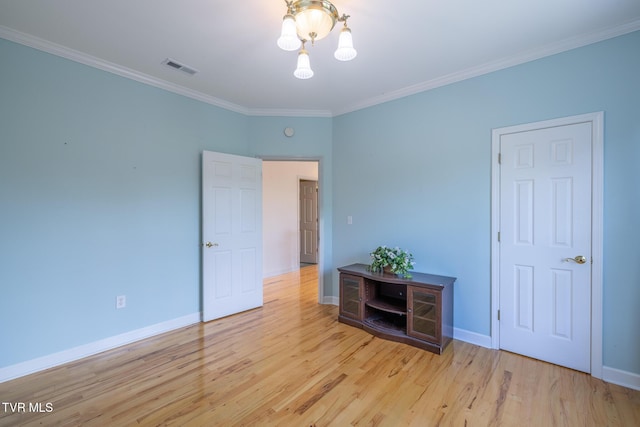 566 Beechwood Rd, Kingsport, TN 37663 - unfurnished room with a chandelier, crown molding, and wood finished floors