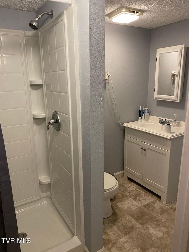 880 E Gilley Ave, Big Stone Gap, VA 24219 - bathroom with a textured ceiling, a stall shower, and vanity