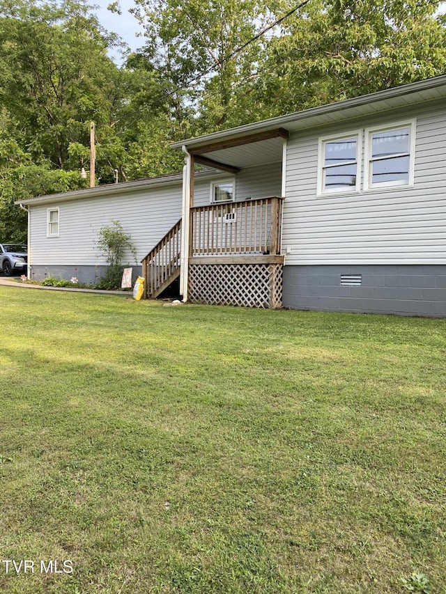 880 E Gilley Ave, Big Stone Gap, VA 24219 - view of front of property with crawl space, a front lawn, and a wooden deck
