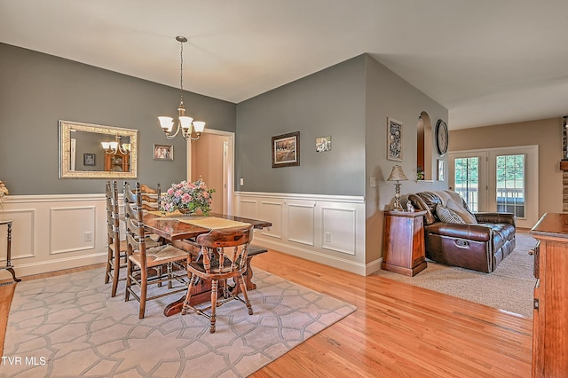 5000 Aberlea Pl, Piney Flats, TN 37686 - dining space featuring a chandelier, light wood-style floors, a wainscoted wall, and a decorative wall