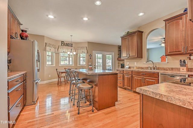 5000 Aberlea Pl, Piney Flats, TN 37686 - kitchen with a breakfast bar, recessed lighting, light wood-style floors, a center island, and stainless steel refrigerator with ice dispenser