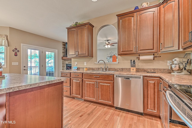 5000 Aberlea Pl, Piney Flats, TN 37686 - kitchen featuring appliances with stainless steel finishes, light wood-style flooring, a ceiling fan, light countertops, and brown cabinets