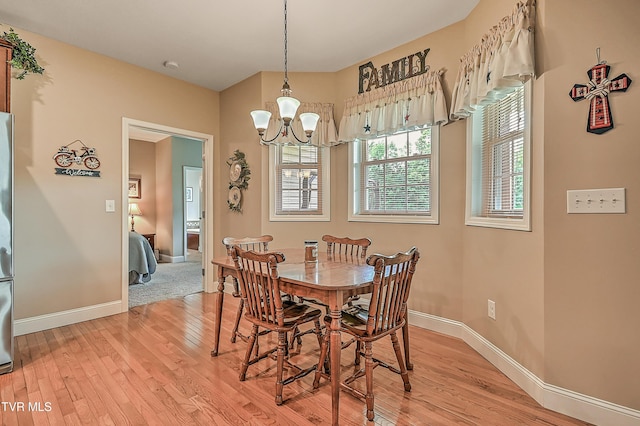 5000 Aberlea Pl, Piney Flats, TN 37686 - dining area with a chandelier and light wood-style floors