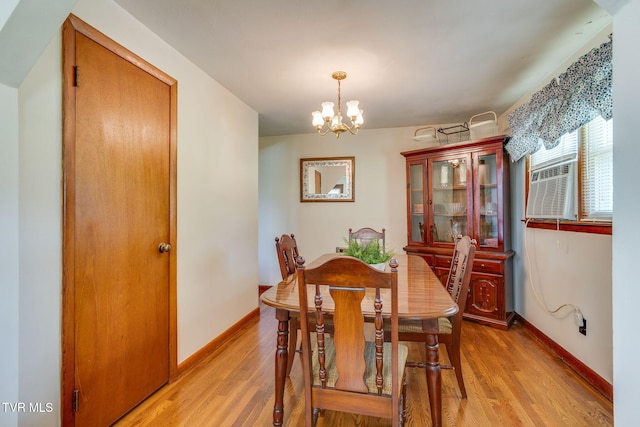221 Mcfarland Dr, Kingsport, TN 37664 - dining room featuring a chandelier, light wood-style floors, and cooling unit