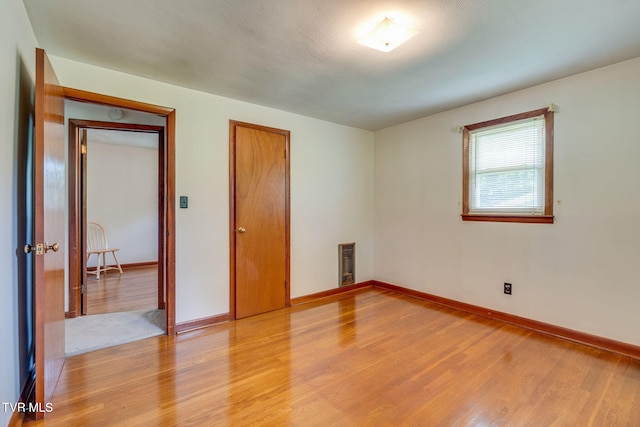 221 Mcfarland Dr, Kingsport, TN 37664 - spare room with light wood-style flooring and heating unit