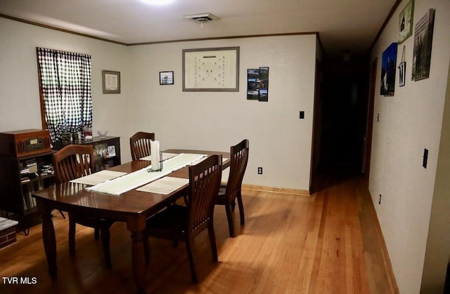 3219 Dungannon Rd, Coeburn, VA 24230 - dining room with light wood-type flooring and crown molding