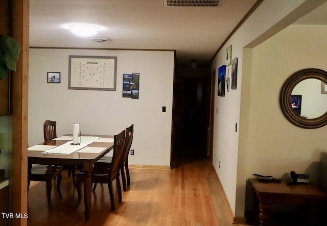 3219 Dungannon Rd, Coeburn, VA 24230 - dining space with light wood-style floors and ornamental molding