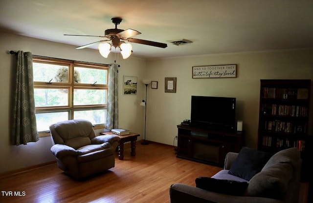 3219 Dungannon Rd, Coeburn, VA 24230 - living area with ceiling fan, light wood finished floors, and crown molding