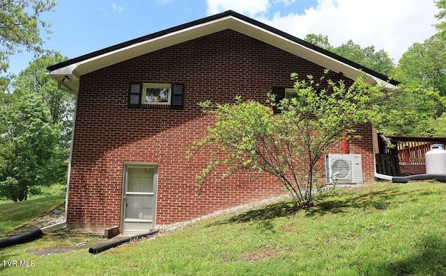 3219 Dungannon Rd, Coeburn, VA 24230 - view of side of home featuring brick siding and a yard