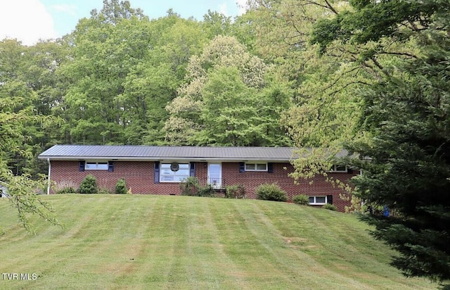 3219 Dungannon Rd, Coeburn, VA 24230 - ranch-style house with brick siding, a front lawn, and a view of trees