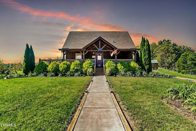 121 Hulse Rd, Jonesborough, TN 37659 - log-style house featuring a front yard, log exterior, a porch, and a shingled roof